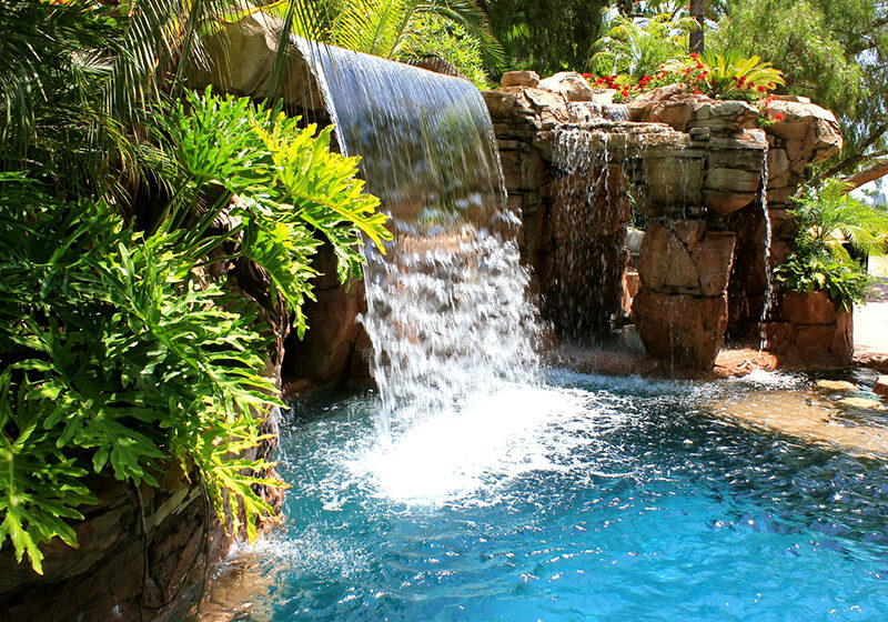 A custom-made artificial rock waterfall and pool, designed and installed by Matrix Concrete Artisans.